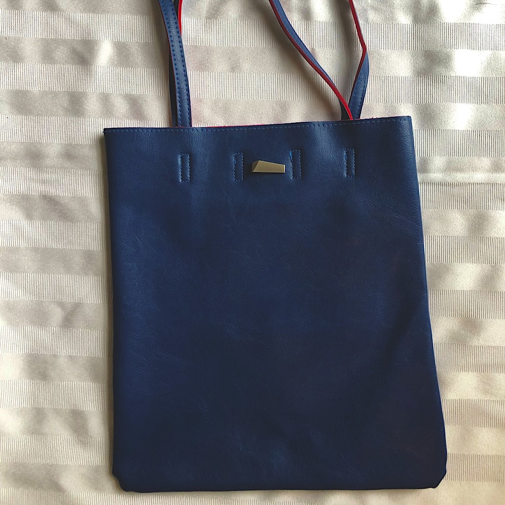 Custom blue leather bag. Red lining.